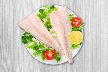 Tasty fresh fish vegetable salad in plate