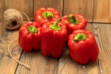 Red peppers on a wooden background