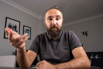 Web cam view, caucasian young business man working from home web cam view. Sit at desk talk on notebook camera having video call or conversation with client, virtual distance meeting.