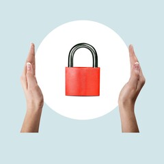 Human hands hold a steel lock