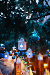 Christmas decorations in Ribeauville Alsace, blue teal and orange lanterns and balls