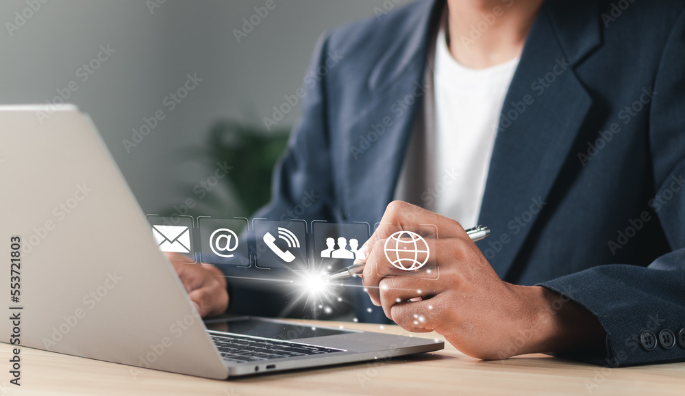 Poster businessman using laptop pc with contact icons on virtual screen. searching web, browsing informatio