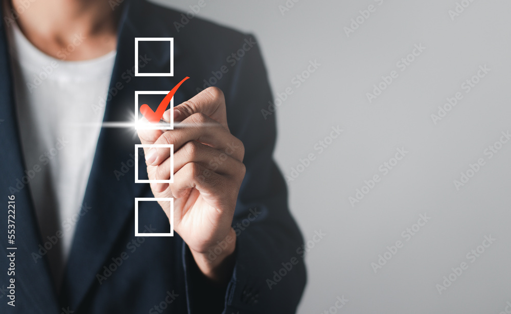 Poster checklist concept. businessman checking mark on checkboxes, copy space.