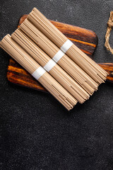 raw buckwheat noodles soba Asian snack healthy meal food snack on the table copy space food background rustic top view