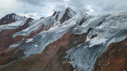 mountain peaks covered with glaciers. cloudy weather in the mountains. panoramic mountain view