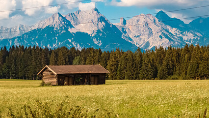 Fototapeta na wymiar Beautiful alpine summer view with a wooden hut near Saalfelden am Steinernen Meer, Salzburg, Austria