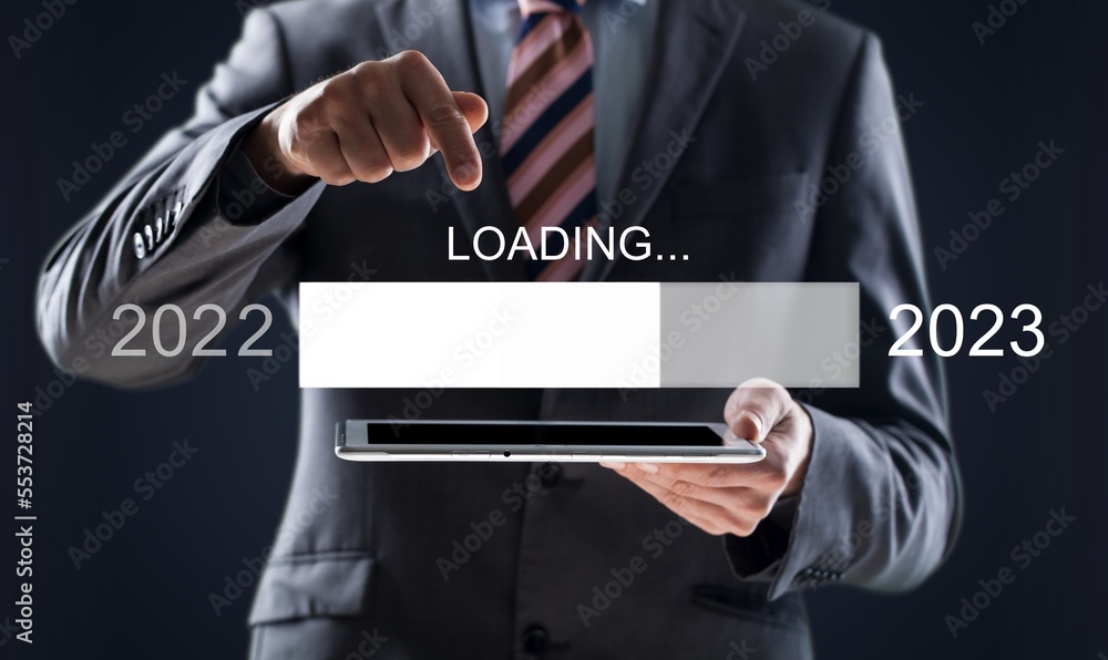 Wall mural Business person holding loading bar and numbers of year