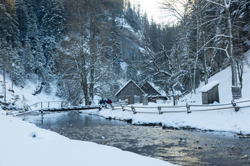 Kvacianka river and lower mill in Kvacianska valley, winter time, Liptov, Slovakia