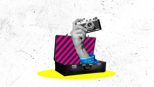 Stop motion, animation. Colorful image of retro photo camera in human hand sticking out from old suitcase.