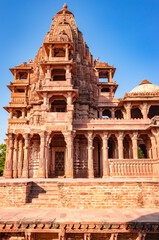 Fototapeta premium ancient hindu temple architecture with bright blue sky from unique angle at day