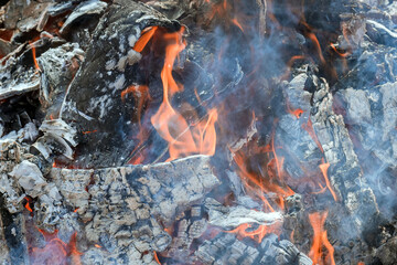 Ashes embers of bonfire after it has been burned firewood has been prepared for barbecue cooking BBQ grill