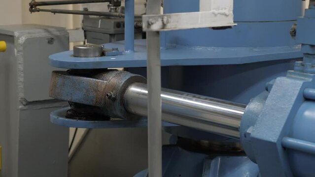 Piston rod moves rudder arm on hydraulic steering gear of ship