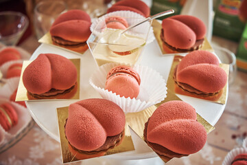 Macaroons and beautiful cakes. Delicious sweets on the banquet table. Close-up. Holiday. Wedding.