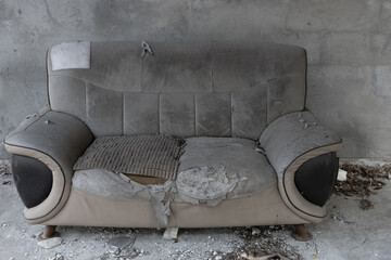 badly damaged sofa at horizontal composition