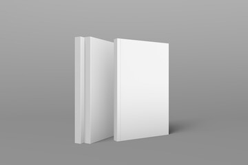 3 book models standing upright on a gray background. 3d realistic render soft cover book mockup. Mockup of book with white cover on isolated background.