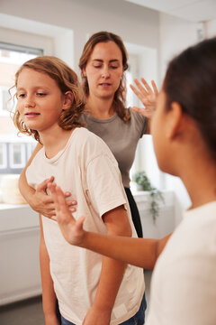 Teacher giving first aid training in case of choking