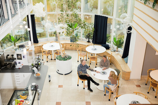 Teacher with students talking in cafeteria