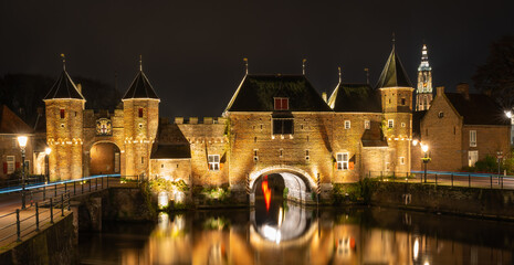 Fototapeta na wymiar The Koppelpoort at night, medieval gate in dutch city of Amersfoort