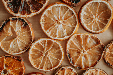 Dried orange, lemon, and tangerine slices. Candied citrus fruit food background. Top view with copy...