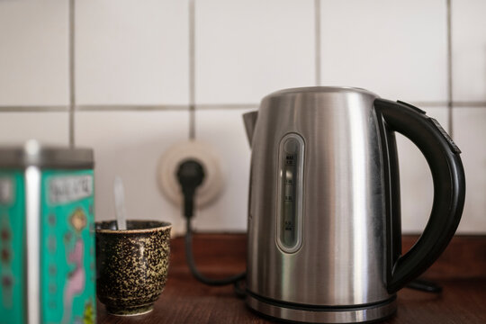 Electric kettle and cup with spoon