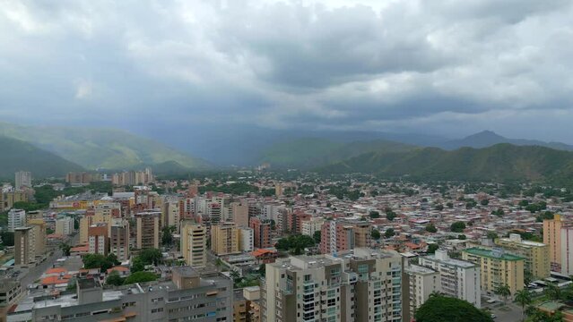 Aerial view of Maracay city on cloudy weather. The capital of the state of Aragua, Venezuela. The Caribbean town is surrounded by mountains