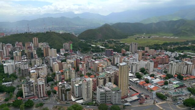 Aerial orbit view of Maracay city in north-central Venezuela. The capital of the state of Aragua. The Caribbean town is surrounded by mountains