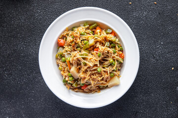 rice noodle vegetable mix green beans, carrots, bean, tonga beans, green peas veggie vegan food vegetarian asian food snack meal on the table copy space food background rustic top view