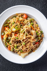 rice noodle vegetable mix green beans, carrots, bean, tonga beans, green peas veggie vegan food vegetarian asian food snack meal on the table copy space food background rustic top view