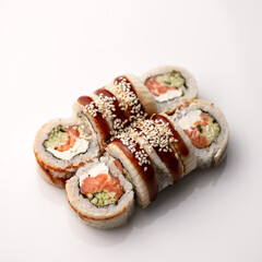 Sushi rolls with eel, cream cheese, salmon, cucumber. Healthy diet. Japanese cuisine. Isolate on a white background. View from above. Serving dish. Soft focus. Copy space.