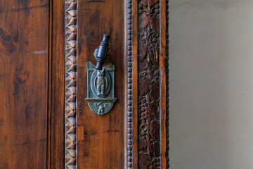 Antique decor on the front doors. Background with selective focus and copy space