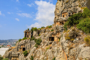Fototapeta na wymiar Lycian rock tombs of the necropolis in Demre, the ancient city of Myra, one of the main centers of Lycia