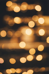 Blurred golden lights on a black background.