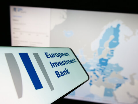 Stuttgart, Germany - 11-30-2022: Smartphone with logo of EU institution European Investment Bank (EIB) on screen in front of website. Focus on center of phone display.