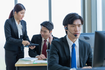 A group of young Asian businessmen Talking and planning work happily and have fun. at the company's office