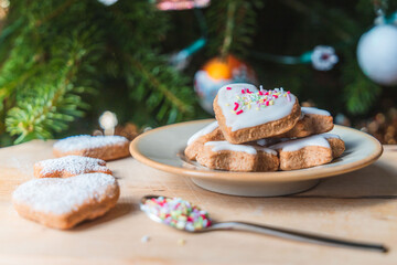 Christmas biscuits with a Christmas tree and snowman. White iced Christmas cookies in different sizes and shapes