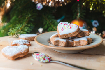 Christmas biscuits with a Christmas tree and snowman. White iced Christmas cookies in different sizes and shapes