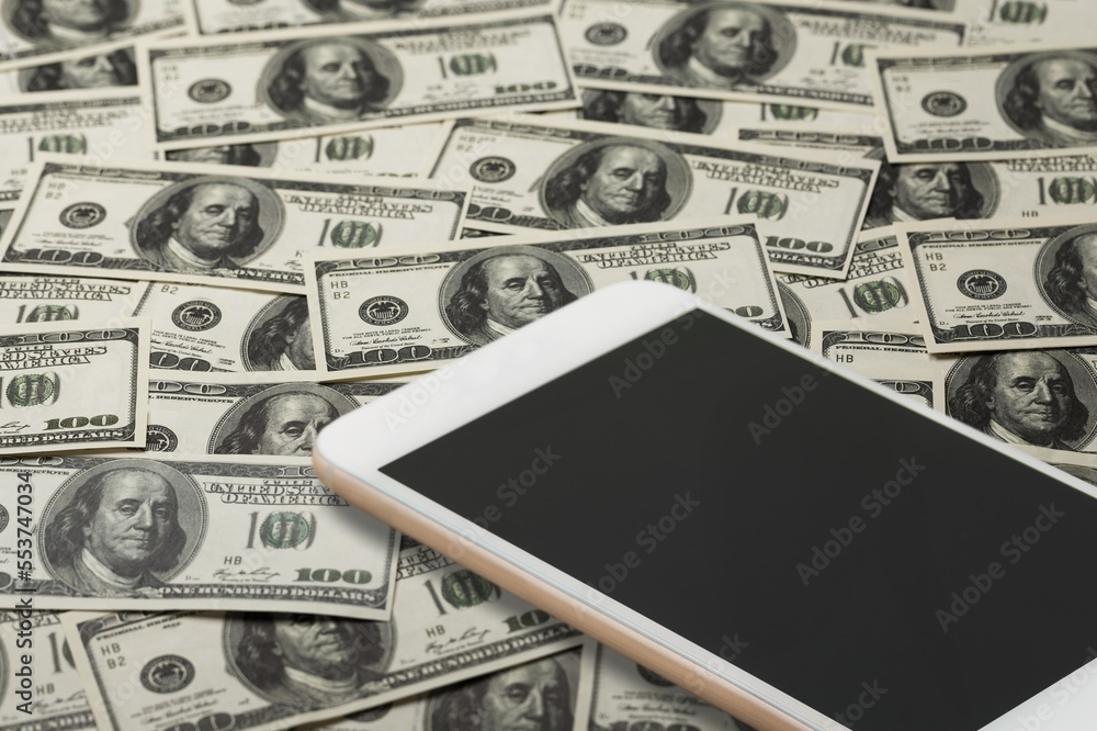 Wall mural Blank screen on modern smartphone and money