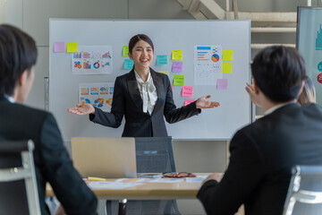 A group of young Asian businessmen Talking and planning work happily and have fun. at the company's office