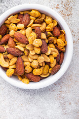nuts mix almonds, cashews, pistachios, peanuts fresh healthy meal food snack on the table copy space food background rustic top view