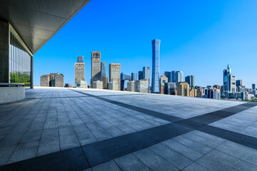 Panoramic skyline and modern buildings with empty square floor in Beijing, China.