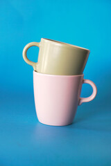 ceramic coffee cup on blue background, mug