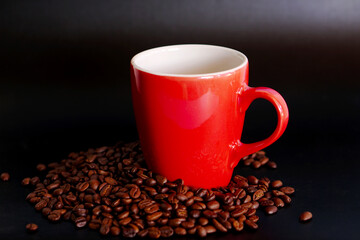 coffee beans in a cup on black background