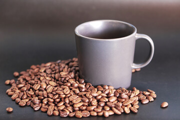 coffee beans in a cup on black background