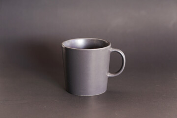 ceramic coffee cup on black background, mug