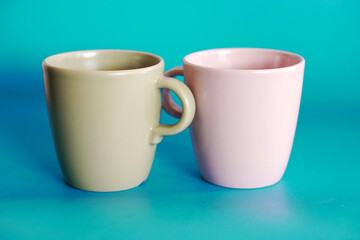 ceramic coffee cup on blue background, drink mug