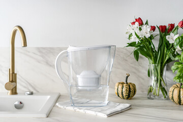 water filter jug with napkin on kitchen table
