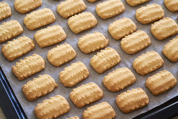 Freshly baked Christmas cookies on a baking sheet