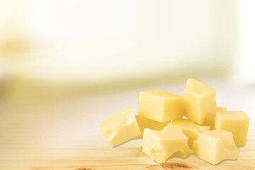 Tasty fresh cheese cubes on the desk
