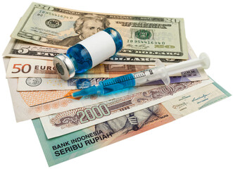 Covid-19 vaccine cost concept. Bottle vaccine on money