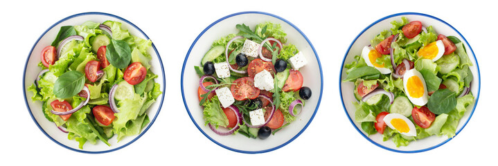 Fototapeta na wymiar Plates with different salads on white background